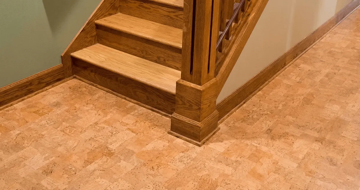 End of a staircase with cork flooring in Austin, TX